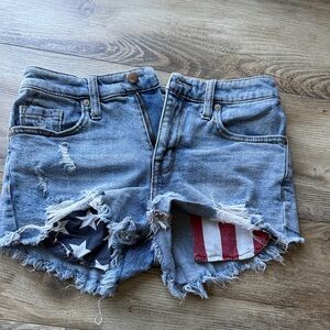 Blue Distressed Jean Shorts with Flag Detail